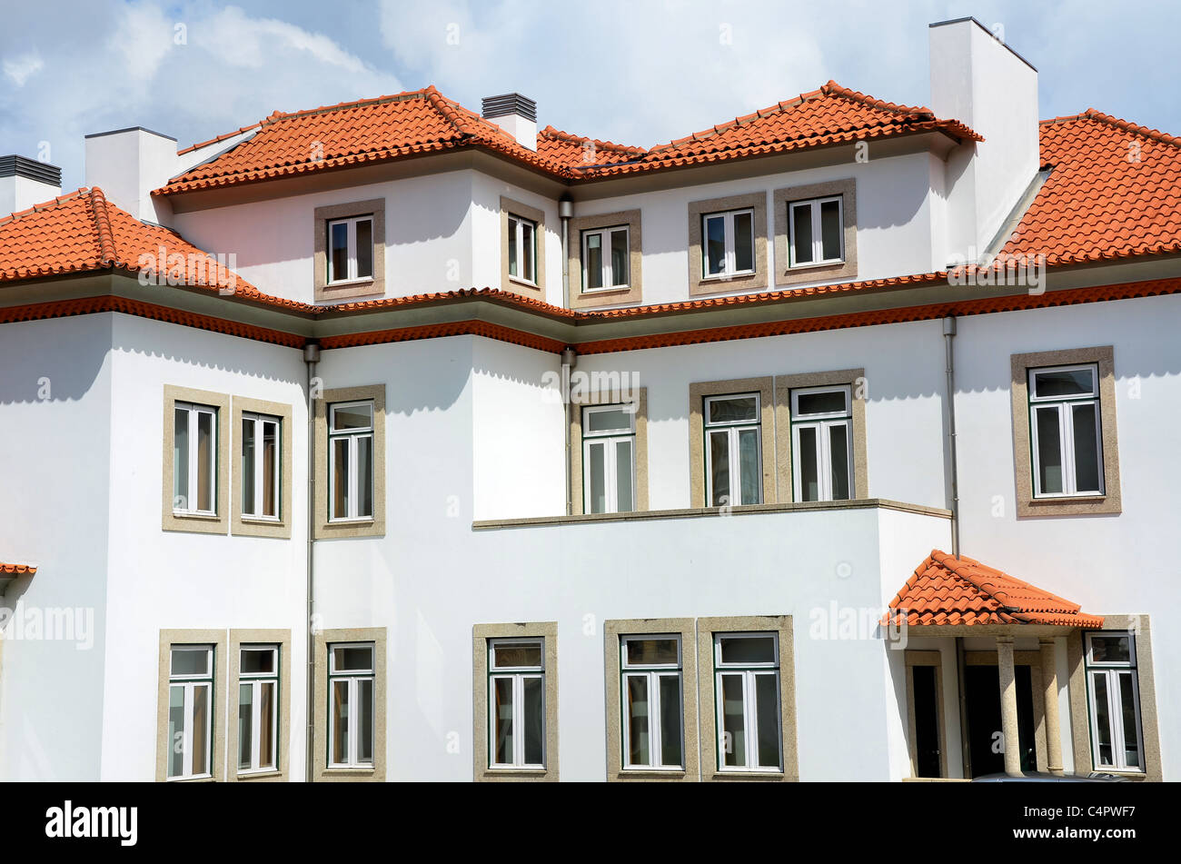 Traditional Portuguese house painted in white and with the roof made of