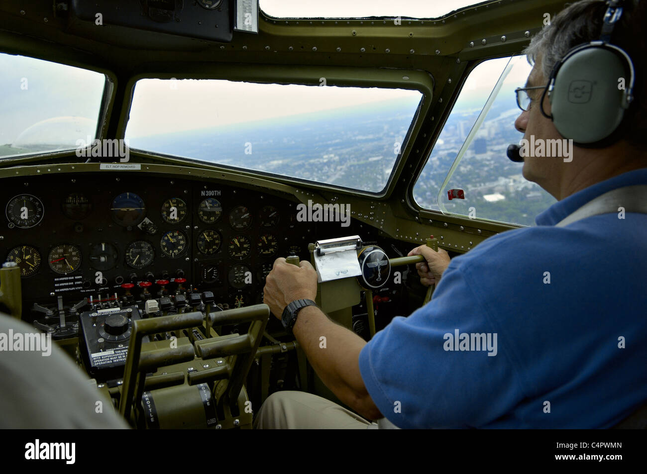 Co-pilot at controls of restored World War II B-17 bomber Liberty Belle in flight over Hartford, Connecticut, August 19, 2006 Stock Photo