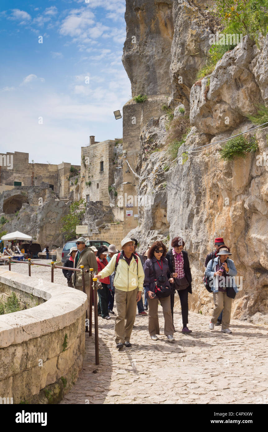 Italy - tourist groups visiting the Sassi of Matera. Stock Photo