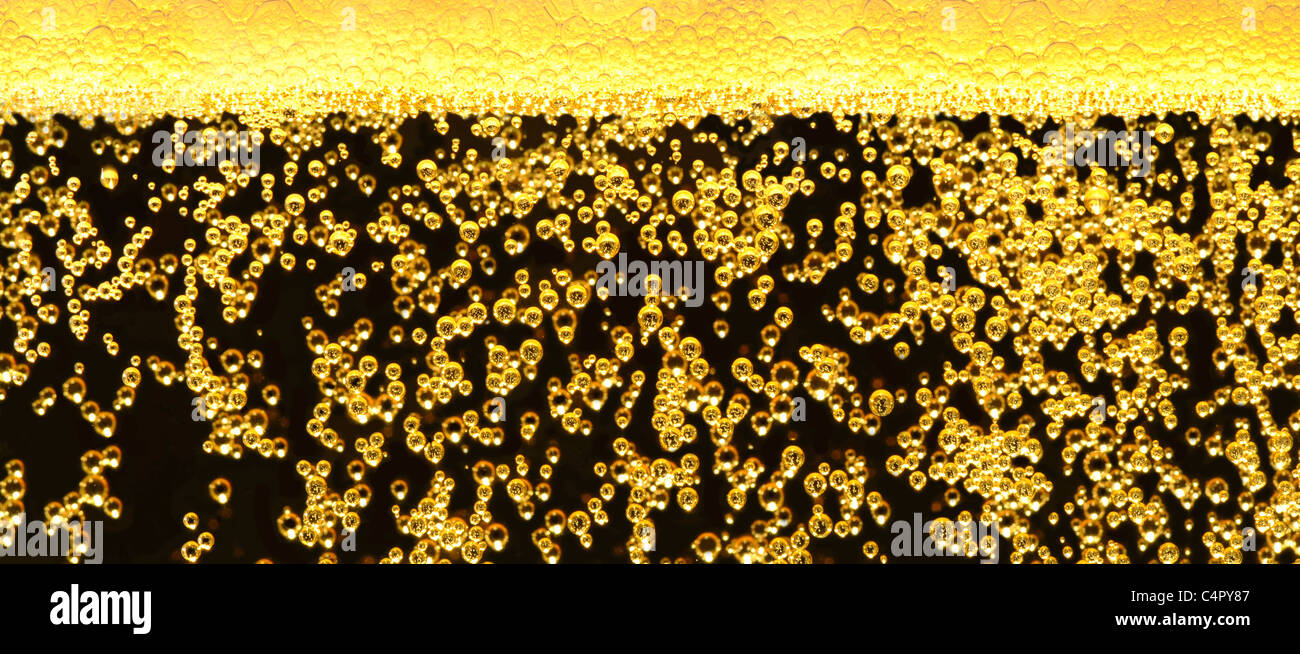 Dark beer bubbling in the glass Stock Photo