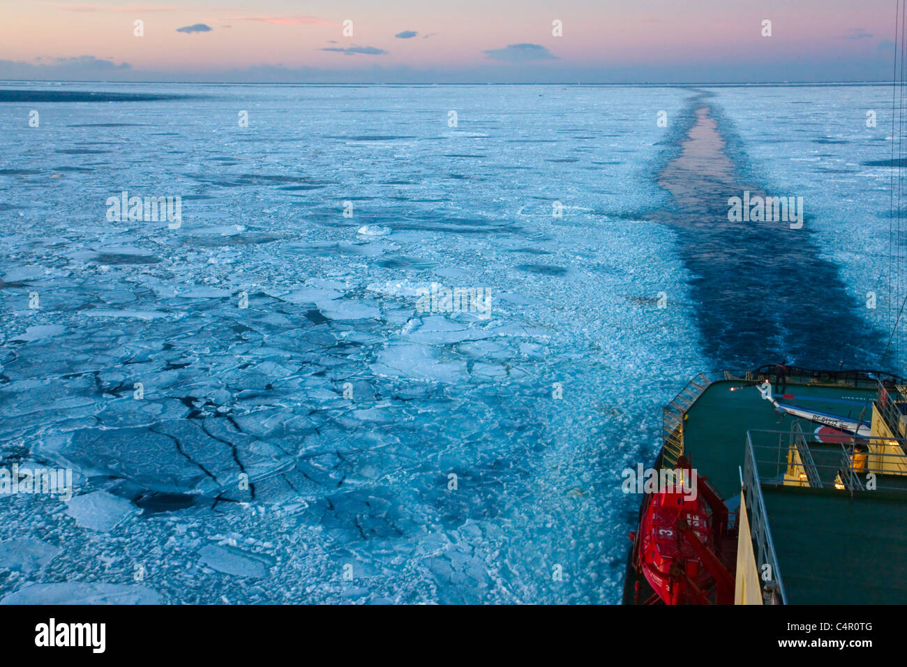 Track left by Icebreaker on the ocean coverd with ice floes, Antarctica Stock Photo