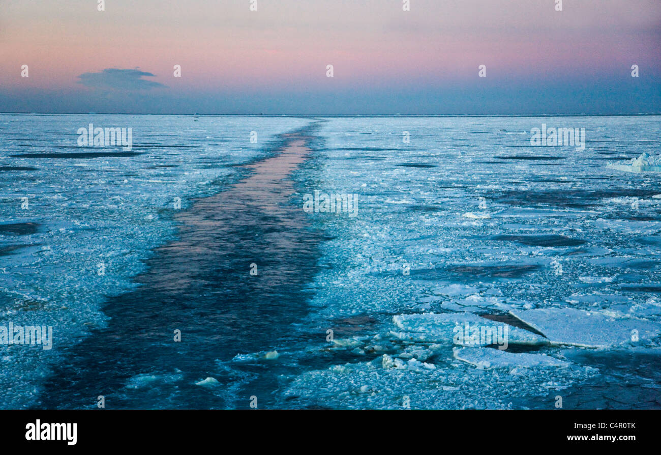 Track left by Icebreaker on the ocean covered with ice floes, Antarctica Stock Photo