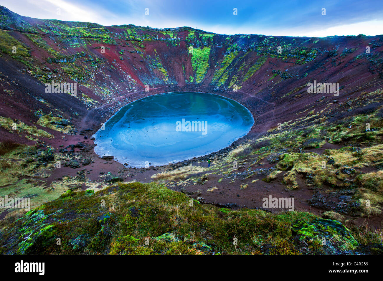 Island iceland eye of the crater Kerid crater lake north of Sellfoss craterlake lake water ice frozen  deep blue lava wide lands Stock Photo