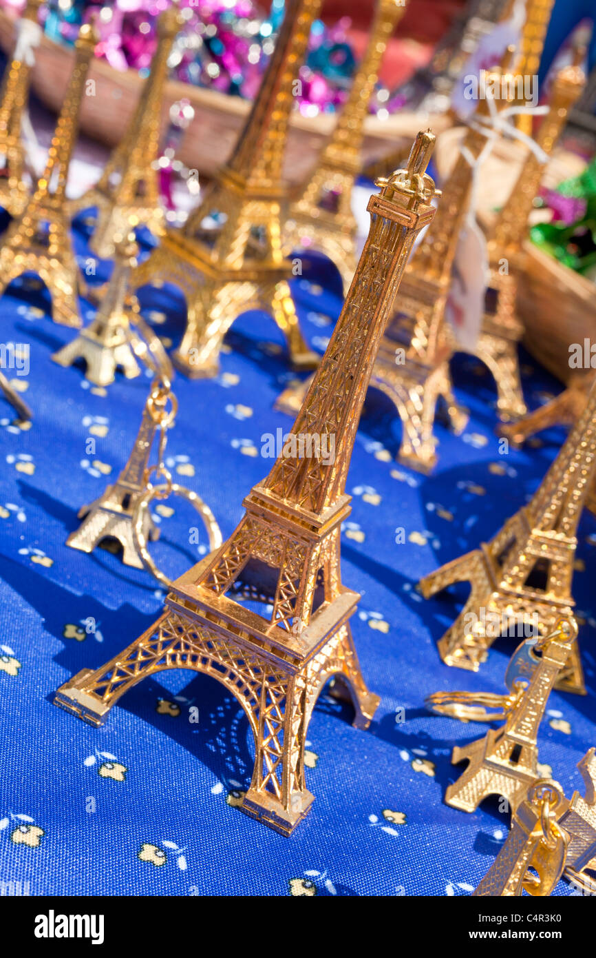 Miniature Eiffel Tower souvenirs selling in street market, Paris, France Stock Photo