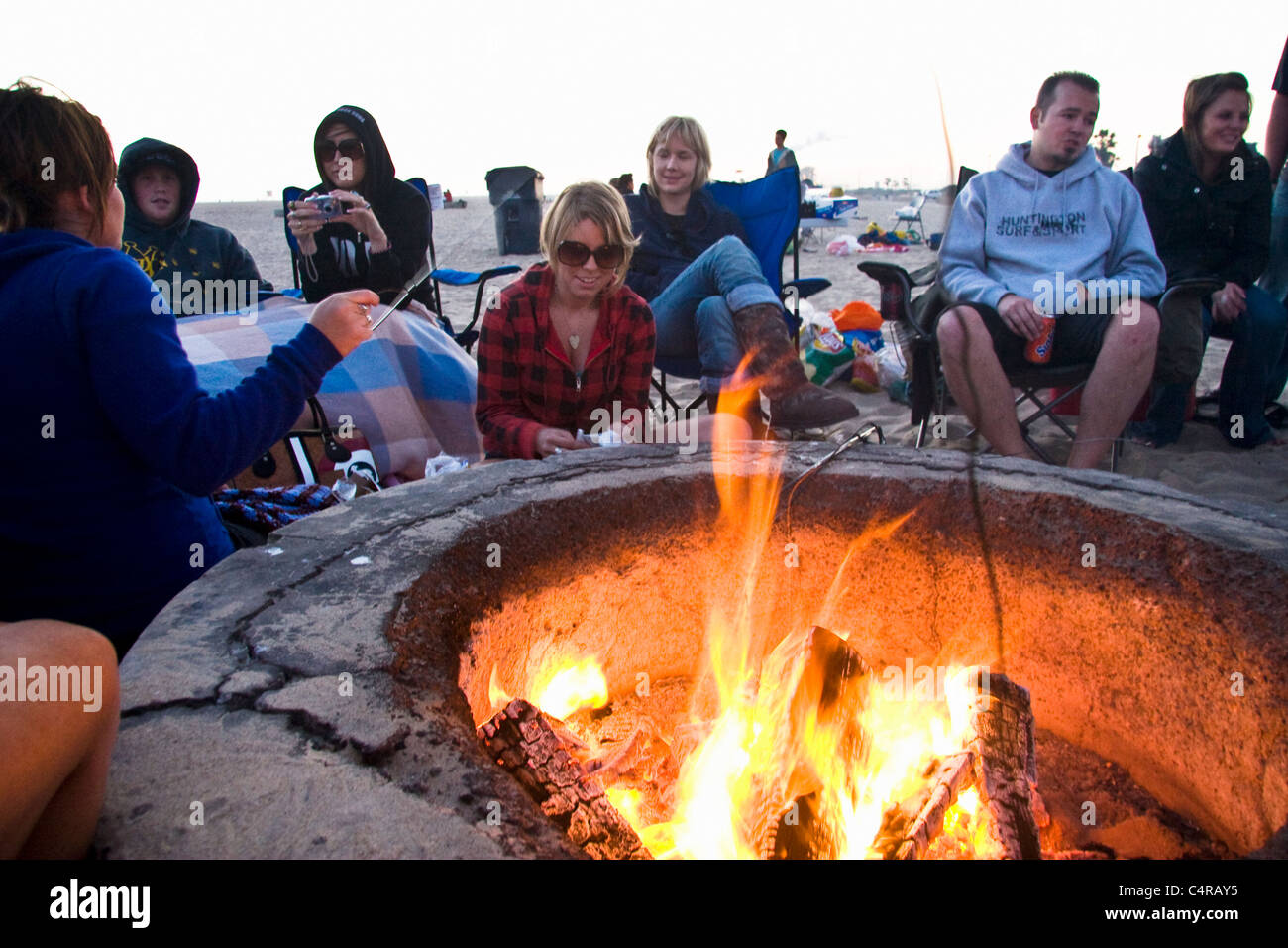 A late summer afternoon around a fire pit at Huntington Beach, California, USA Stock Photo