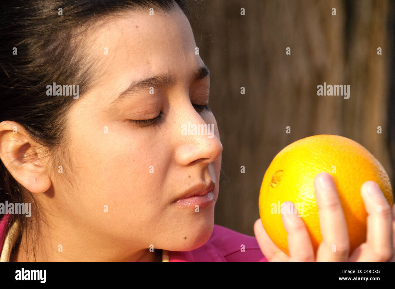 Hispanic woman with fruit. Stock Photo