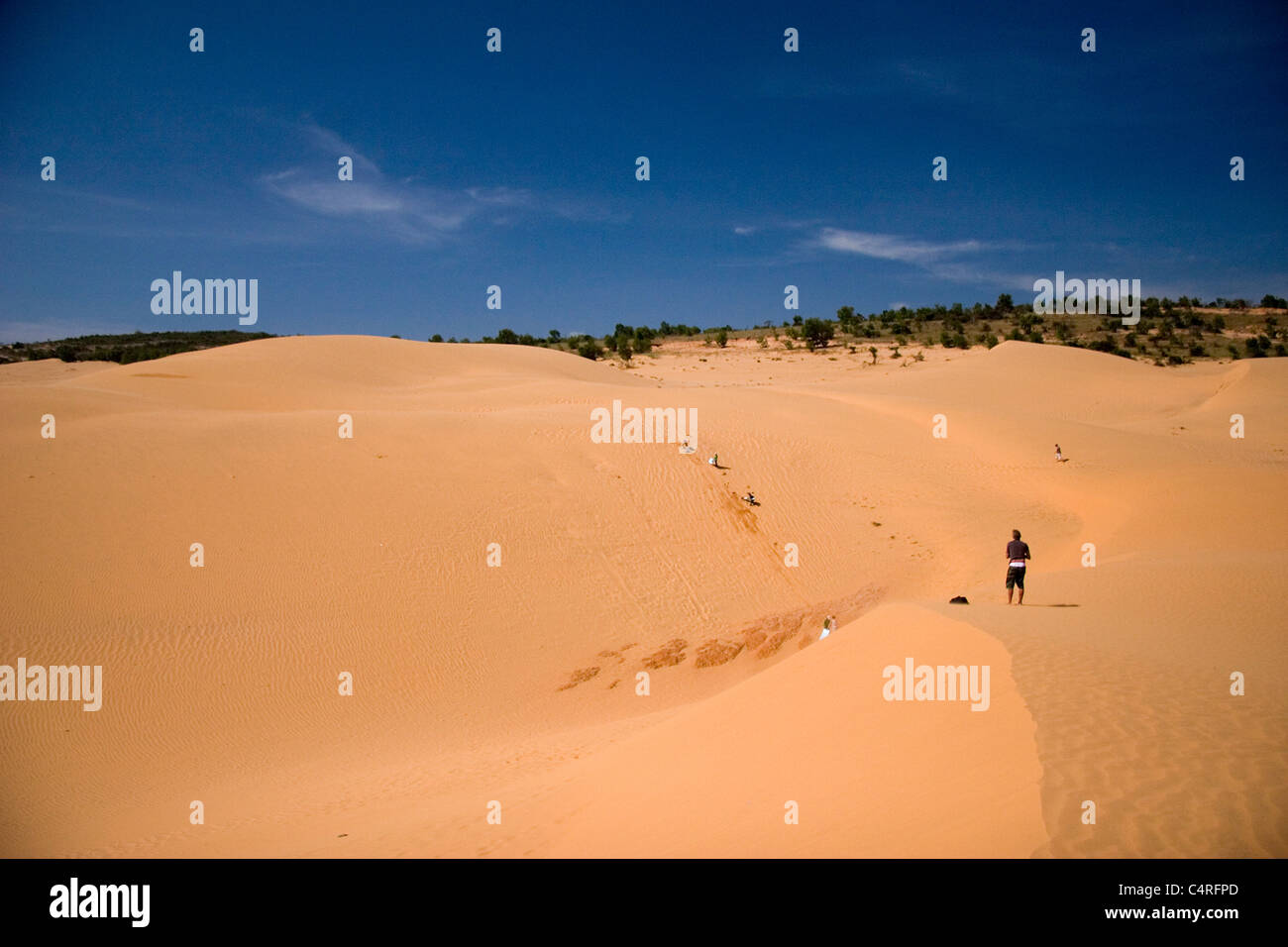 Person in the distance on sandy beach, Mui Ne, Vietnam Stock Photo