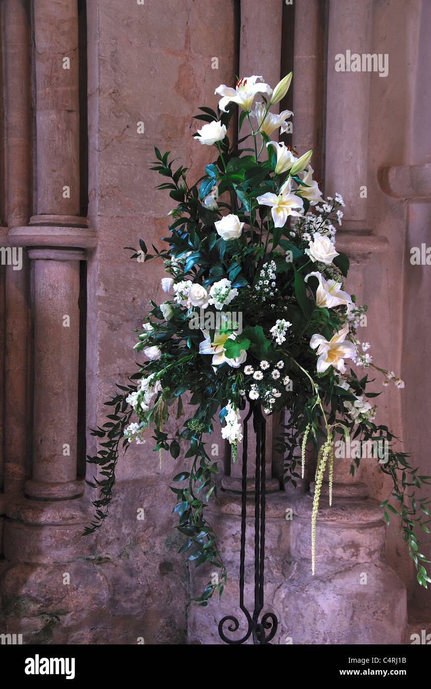 A flower arrangement with a white and green theme in a church UK Stock