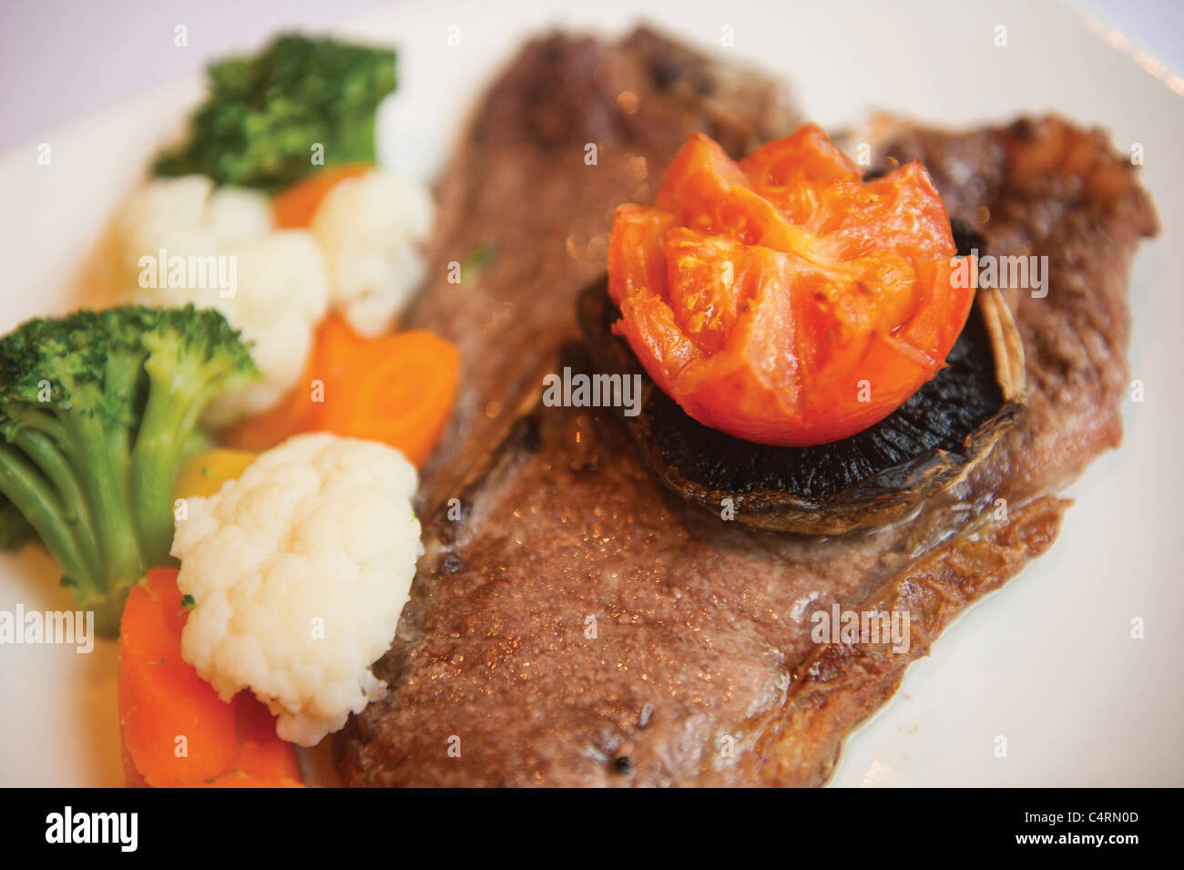 T bone steak with the trimmings vegetables brocolli fresh produce food