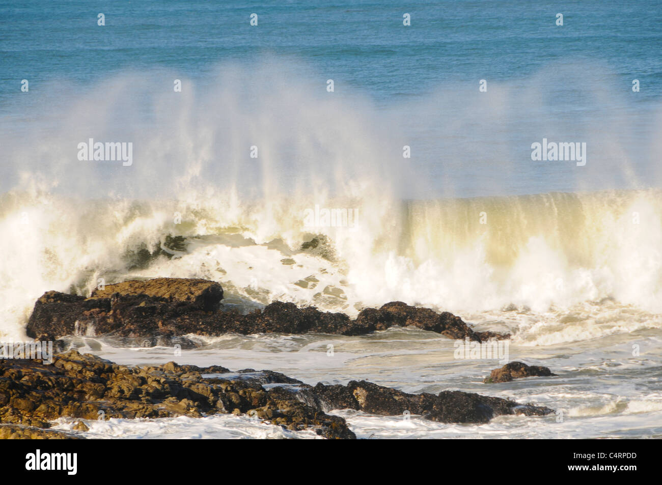 Waves Against the Rocks Stock Photo - Alamy