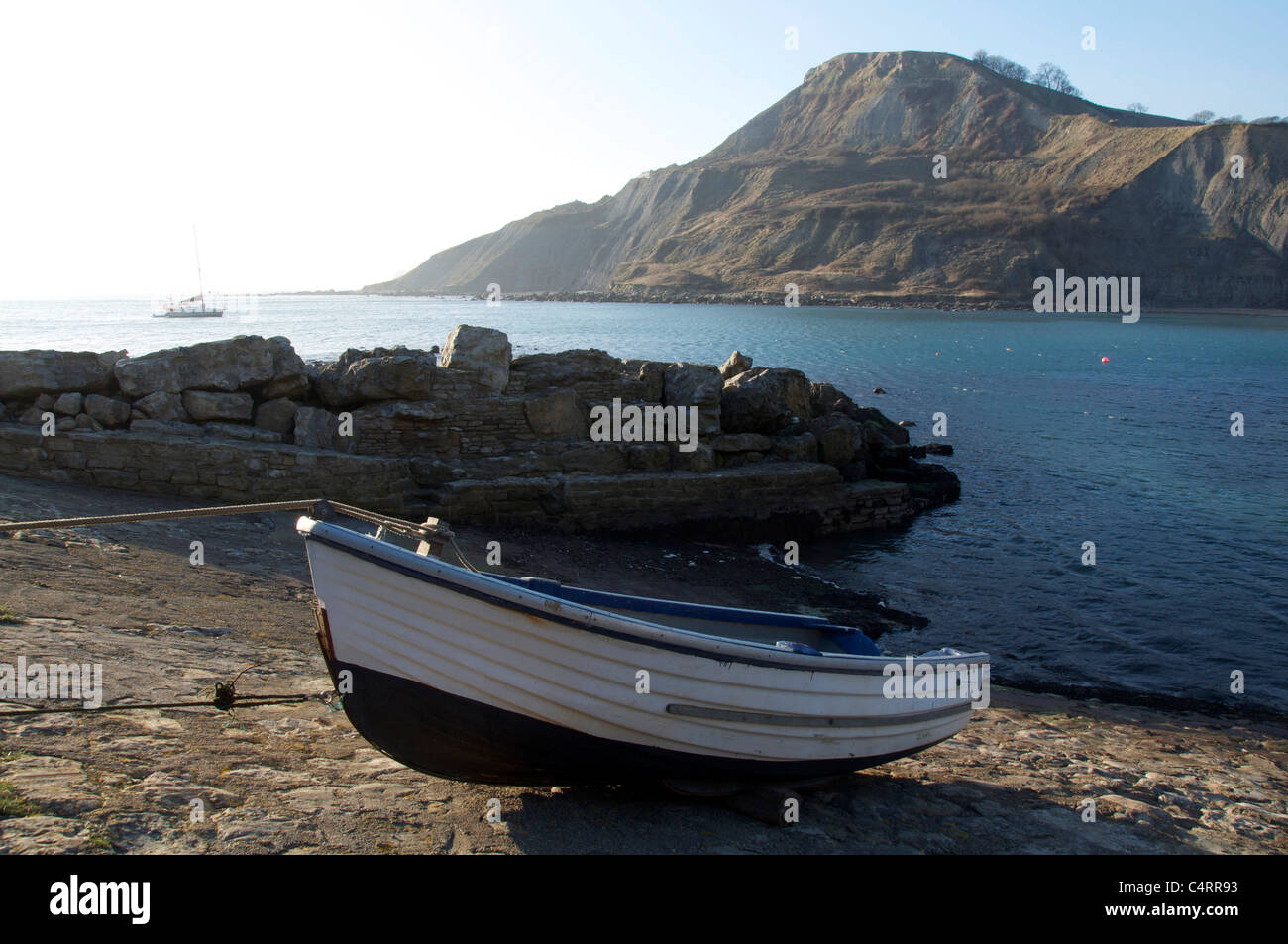 A rowing boat on the slipway at Chapman’s Pool. A remote cove sheltered by towering cliffs on the Isle of Purbeck. Jurassic Coast, Dorset, England, UK Stock Photo