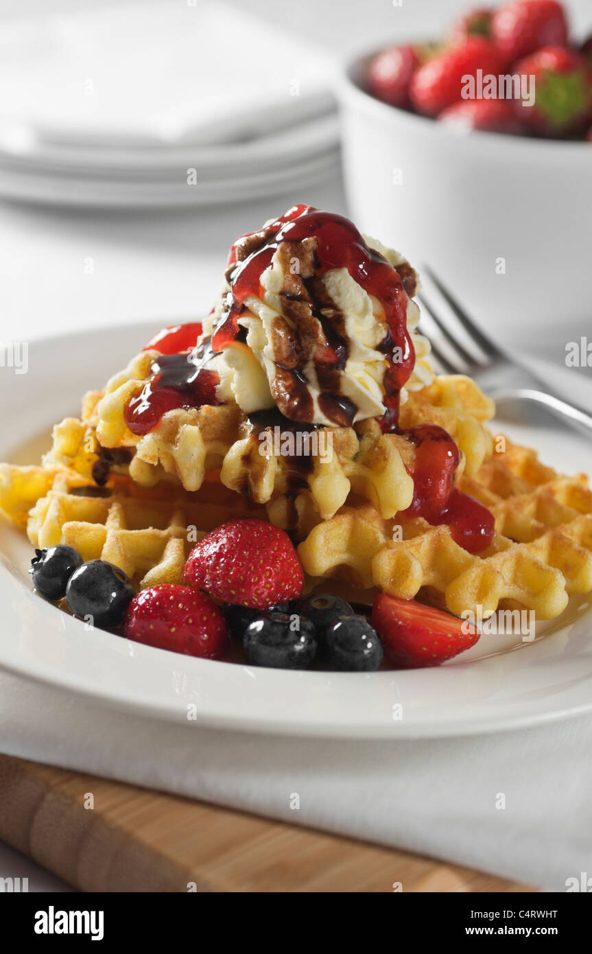 Waffles with fresh fruit and cream Stock Photo