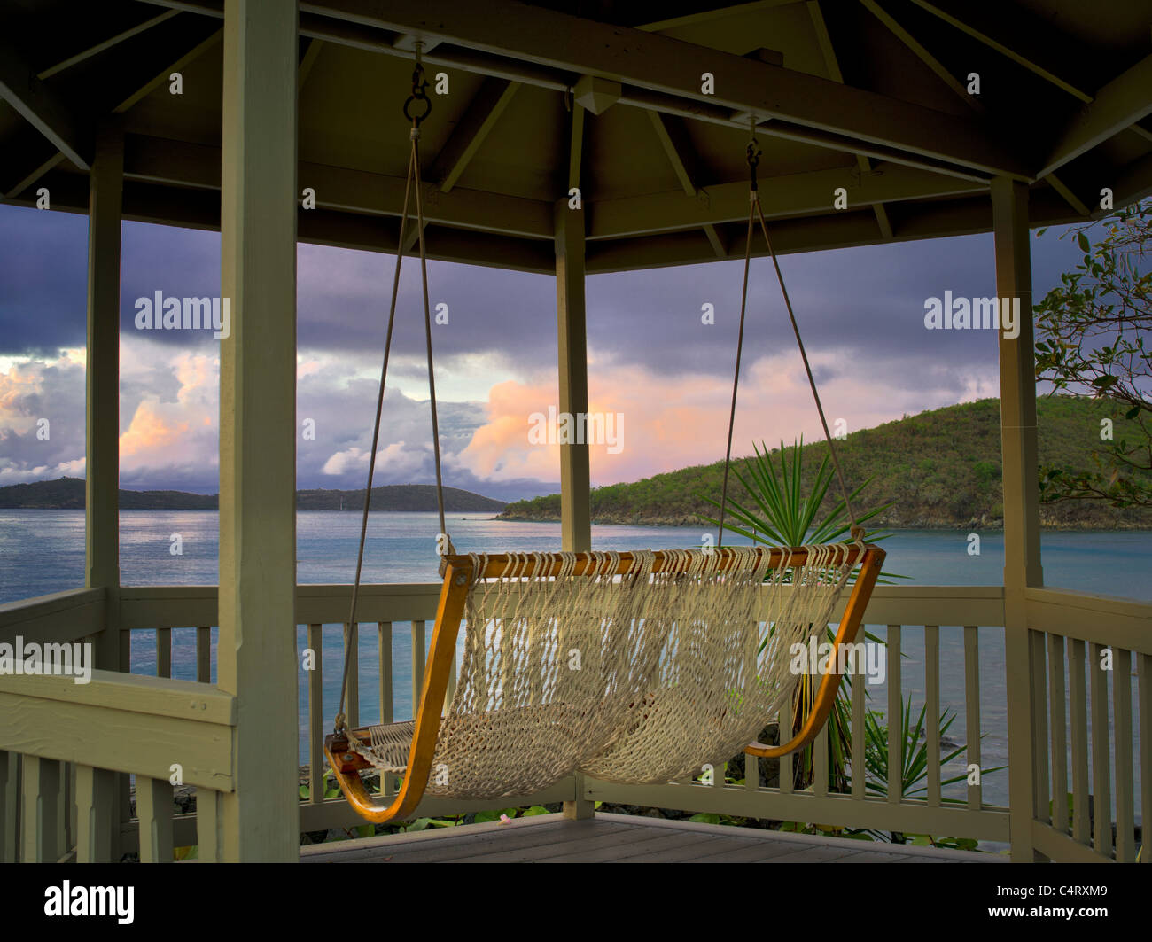 Sunrise with swing in gazebo. St. John, Virgin Islands. Stock Photo