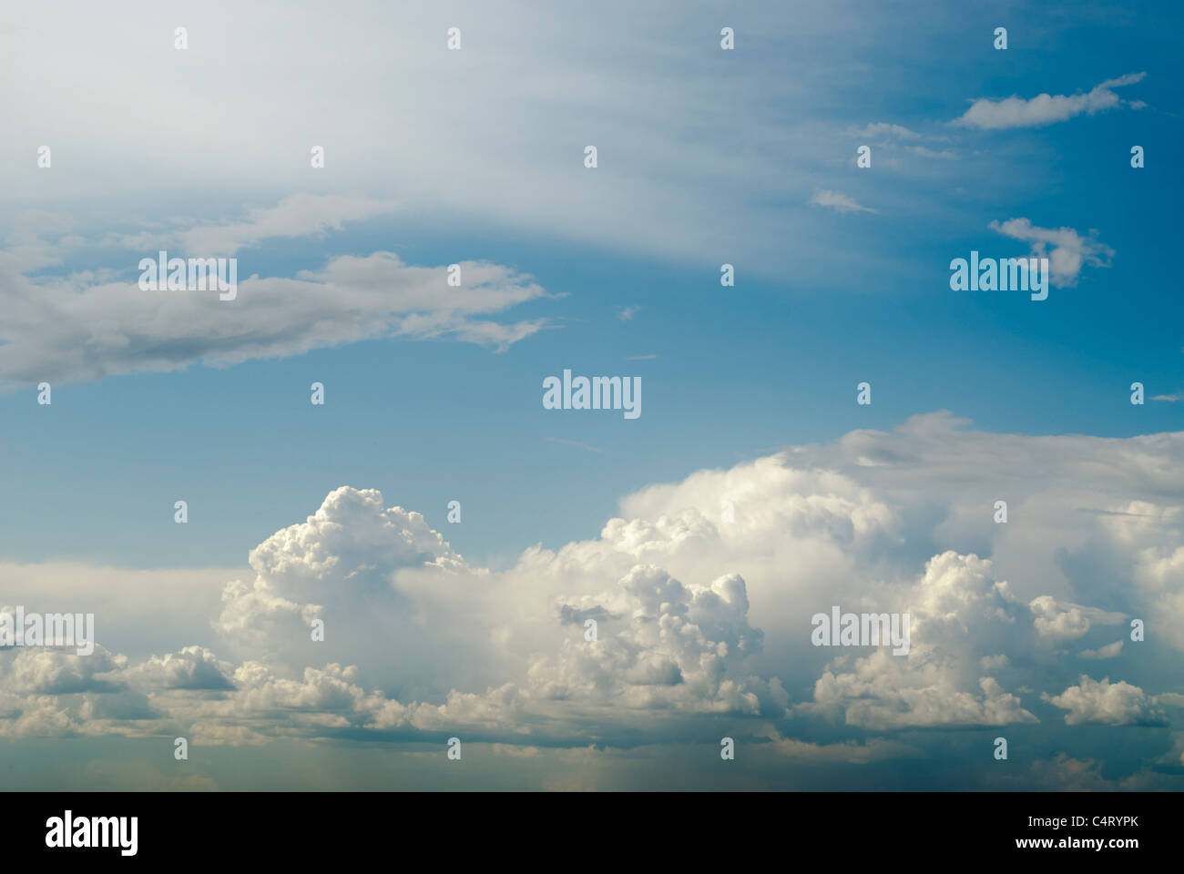 Fluffy clouds on blue sky Stock Photo - Alamy