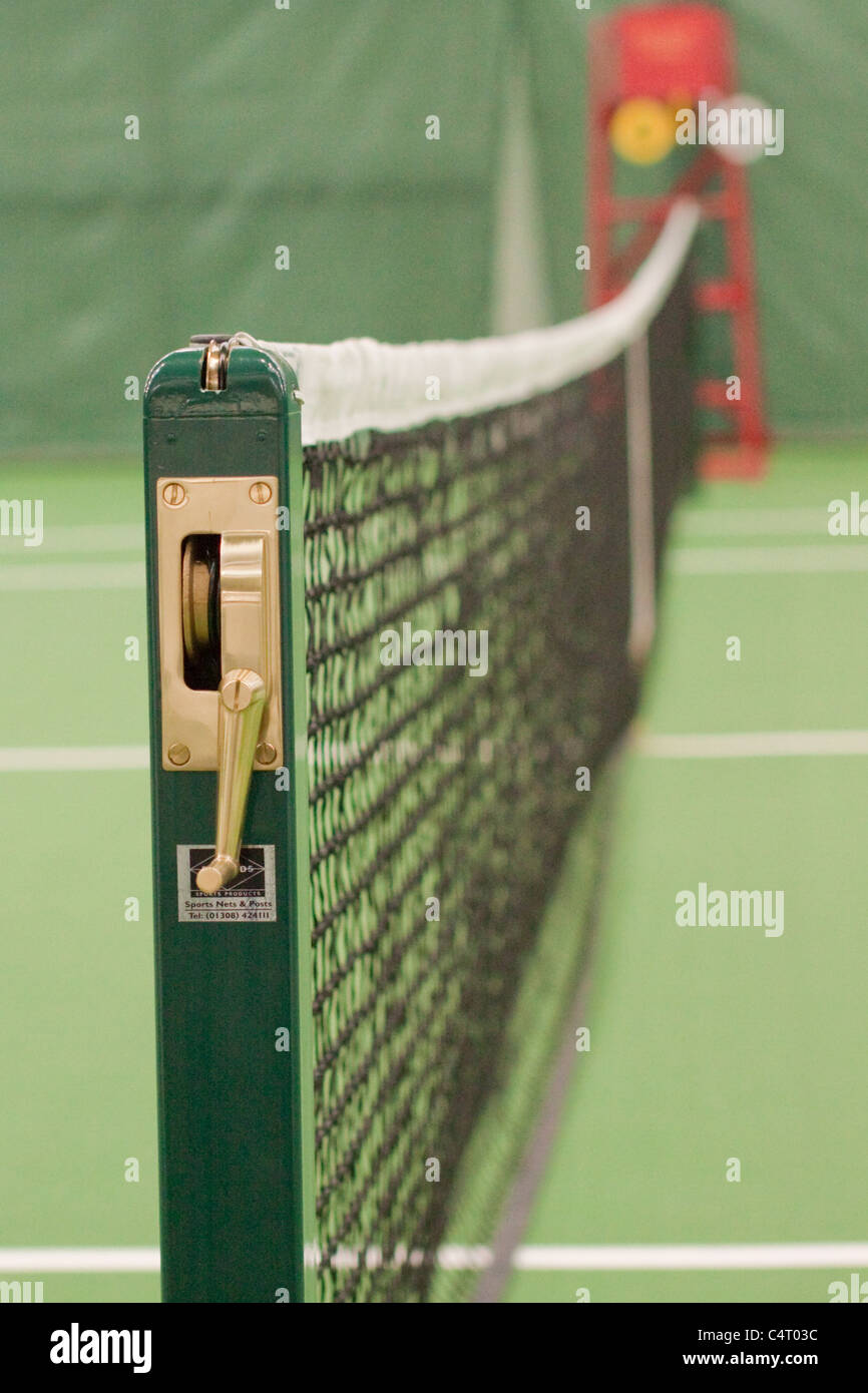 Indoor tennis net with umpires chair Stock Photo