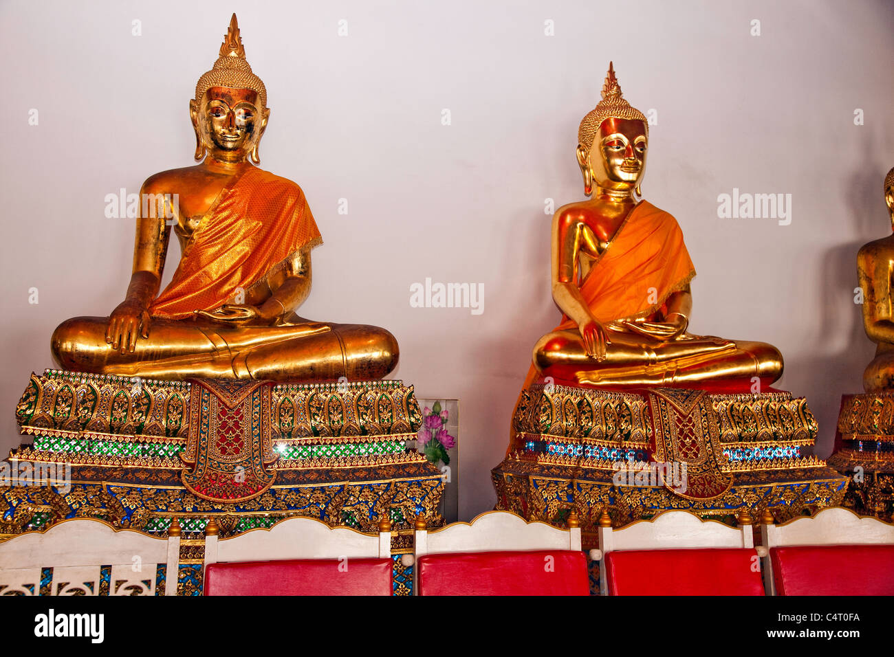 A row of Golden Buddha at Wat Pho Oldest Temple in Bangkok, Thailand, Southeast Asia Stock Photo
