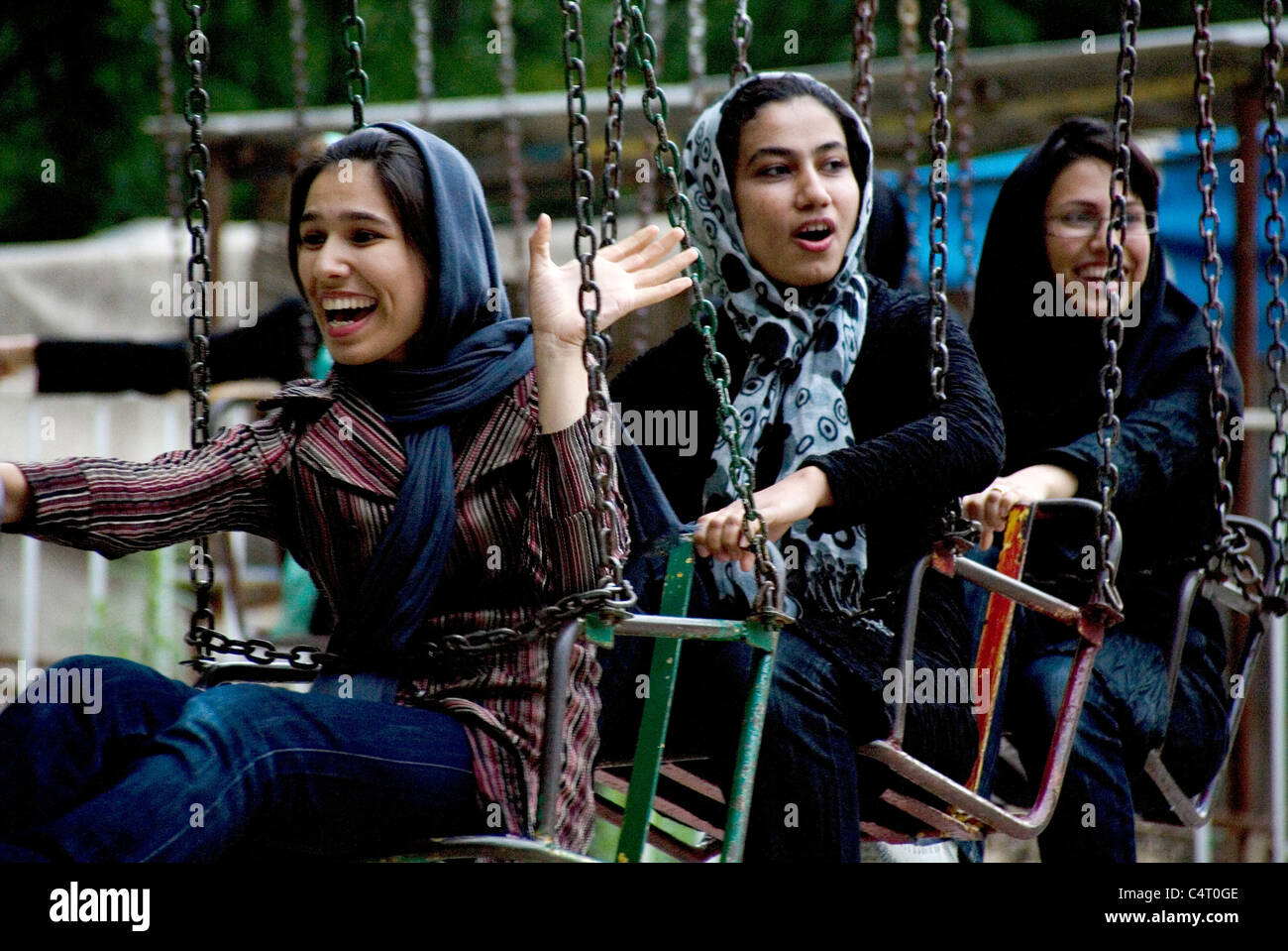 Young Iranian women at amusement park in Gorgan, Iran Stock Photo