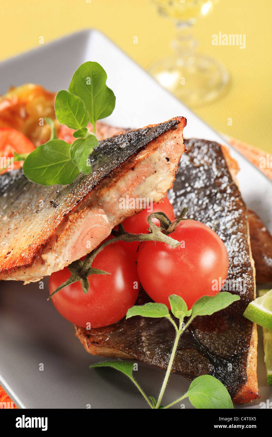 Roasted salmon trout fillets and vegetable garnish Stock Photo