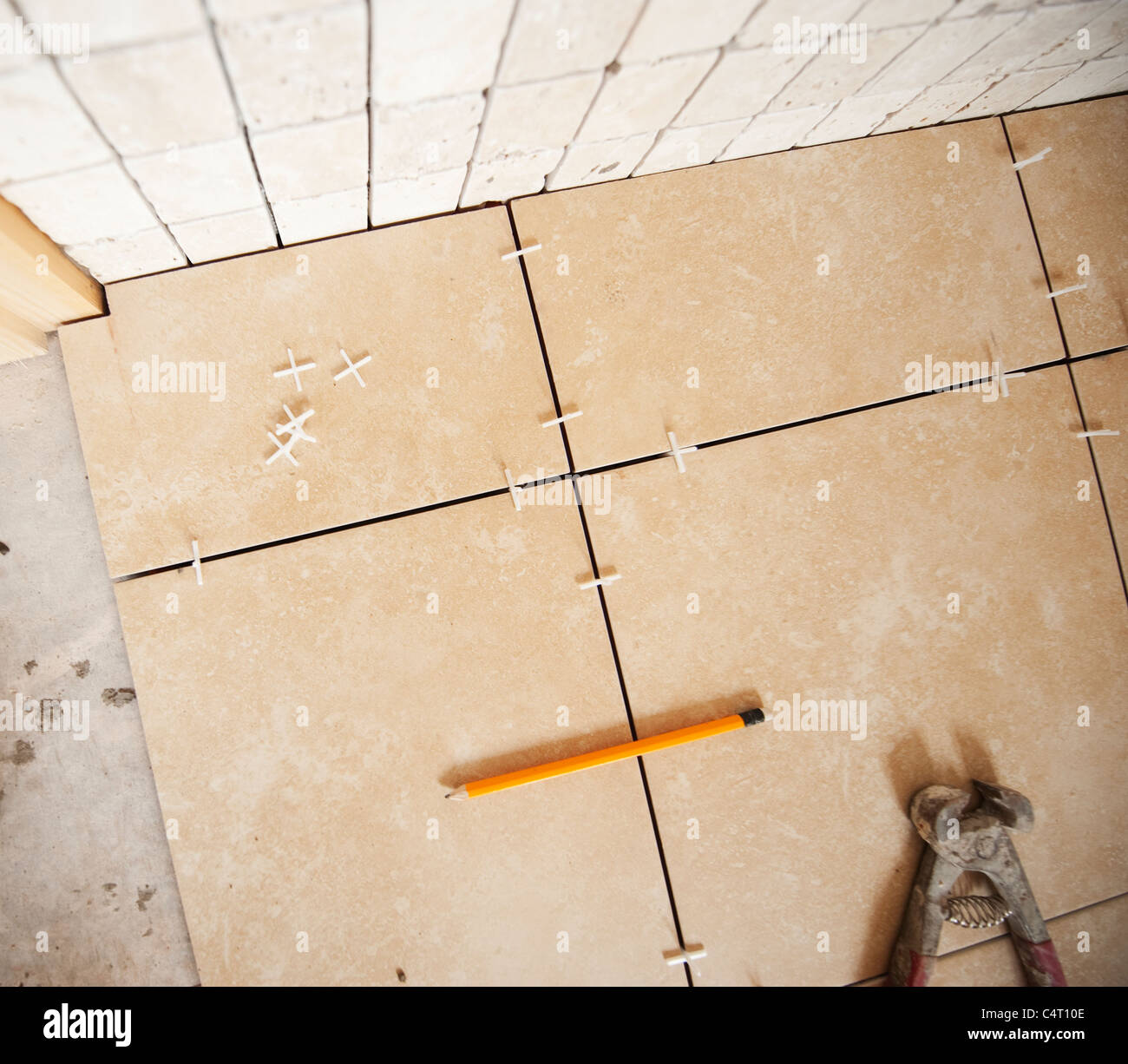 Tiling a bathroom floor and walls Stock Photo Alamy