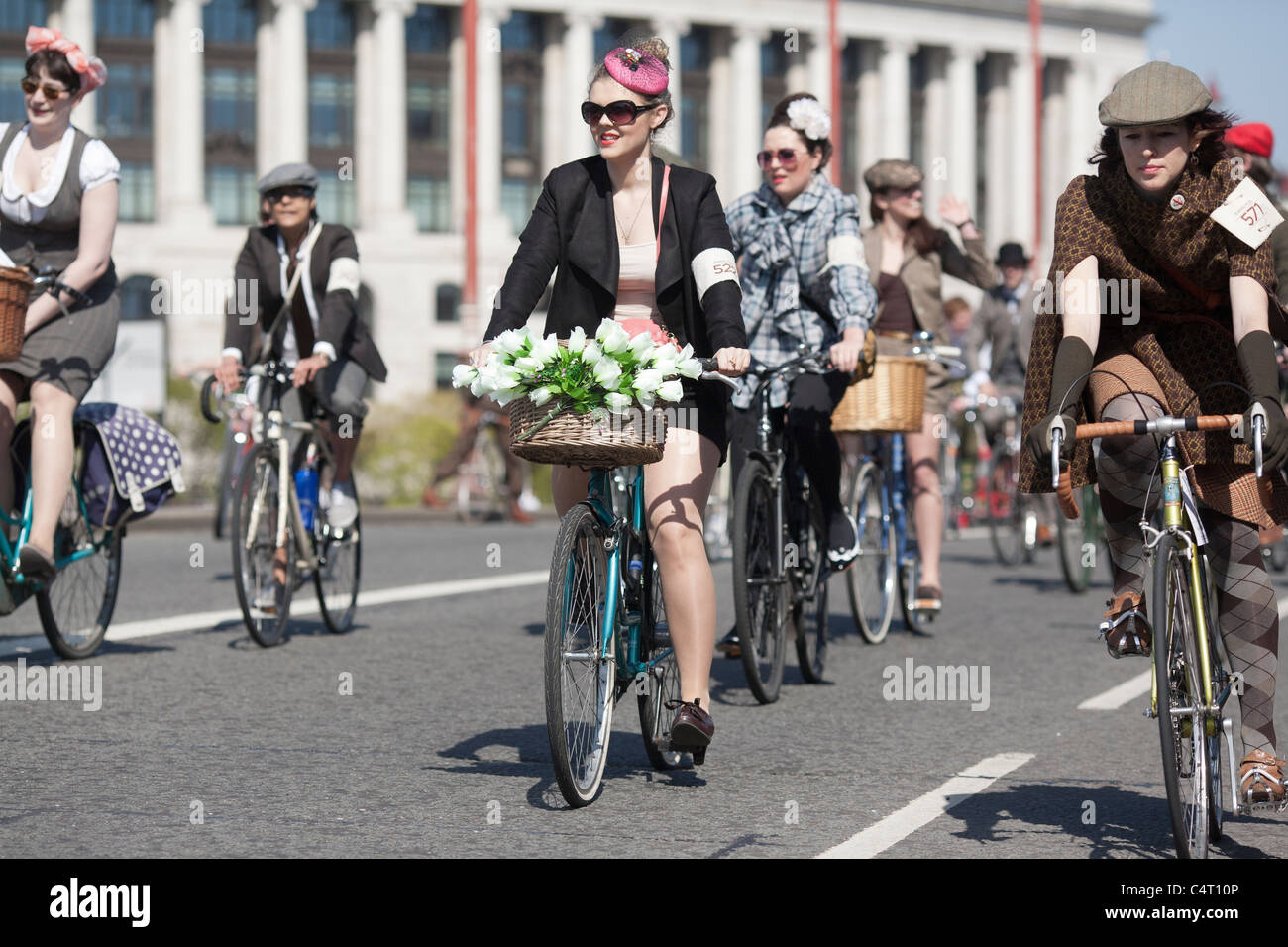 Well-dressed cyclists ride in the London Tweed Run, 2011 Stock Photo