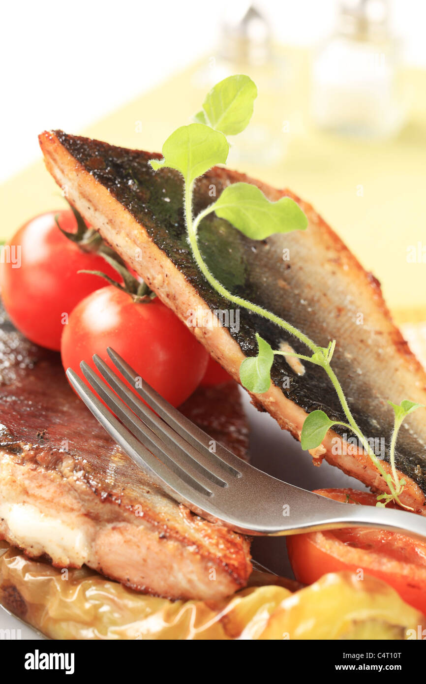 Roasted salmon trout fillets and vegetable garnish Stock Photo