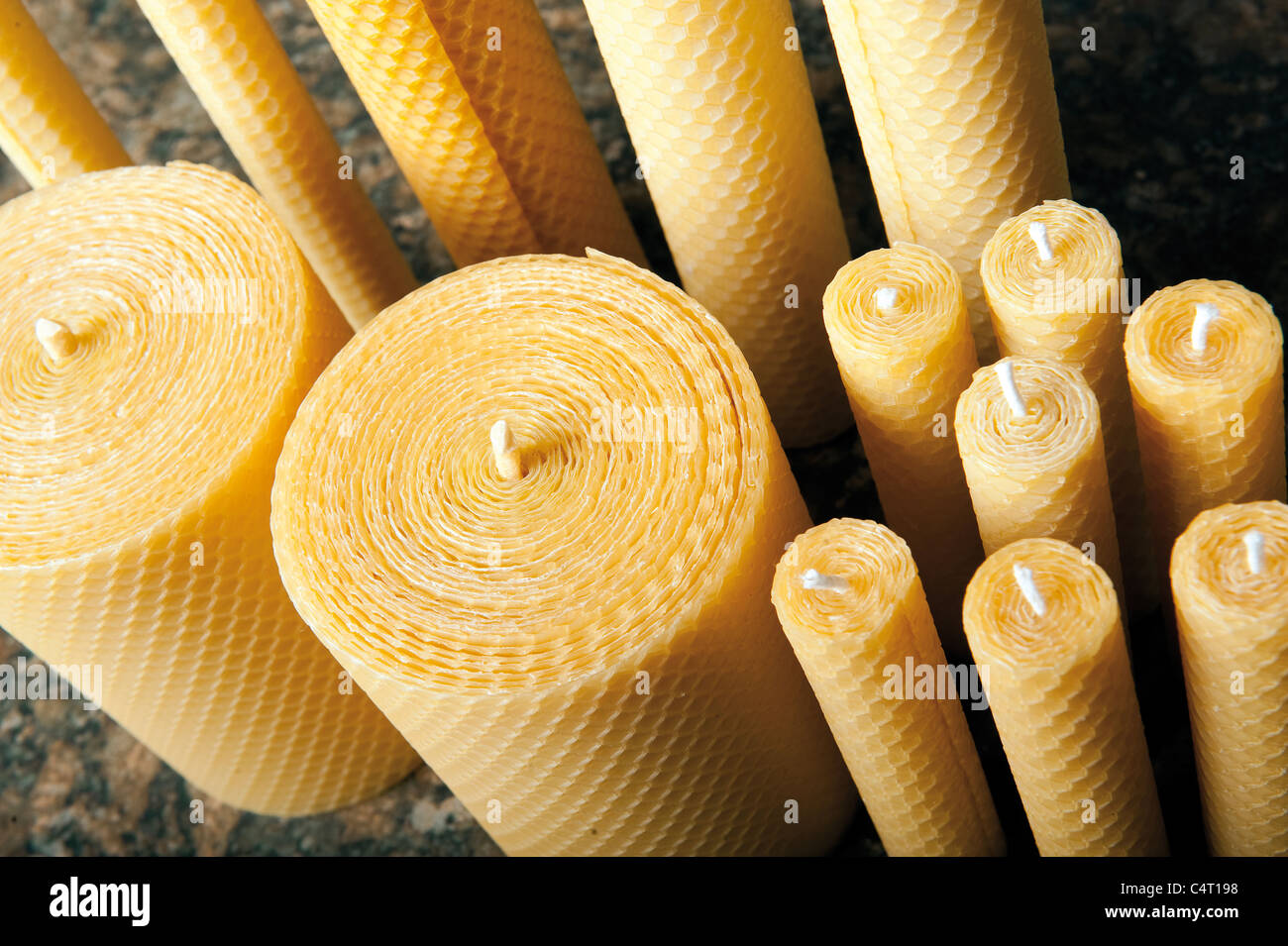 natural Beeswax candles in shape rose, handmade of craft candles, made for  holiday, art and health on dark background, copy spase Stock Photo - Alamy