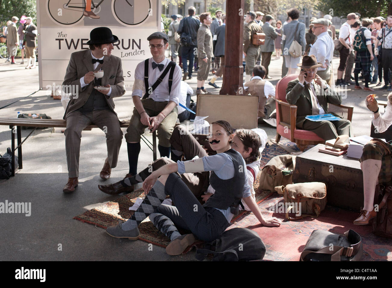 Participants in tweed and flat caps take a tea break during the London Tweed Ride, 2011 Stock Photo