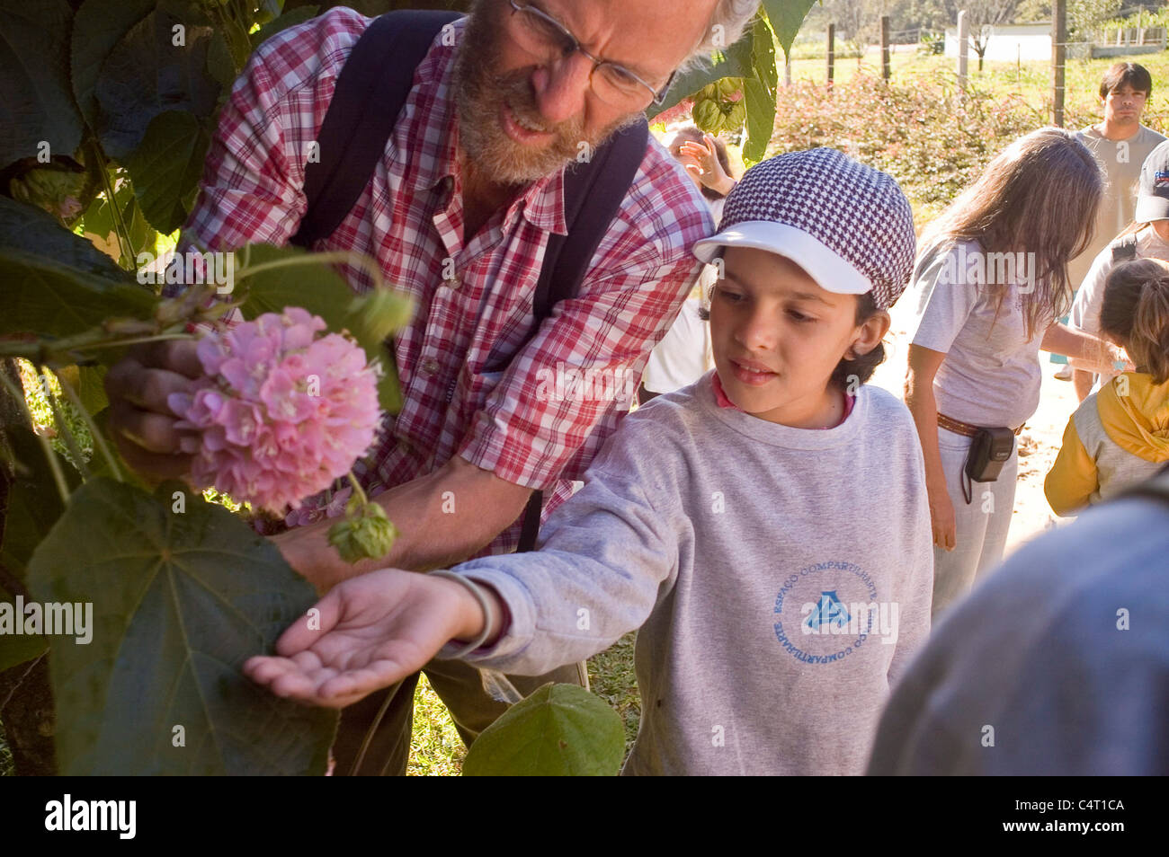 Environmental education for children Gathering seeds for planting. Families spending time together, outdoor recreation Stock Photo