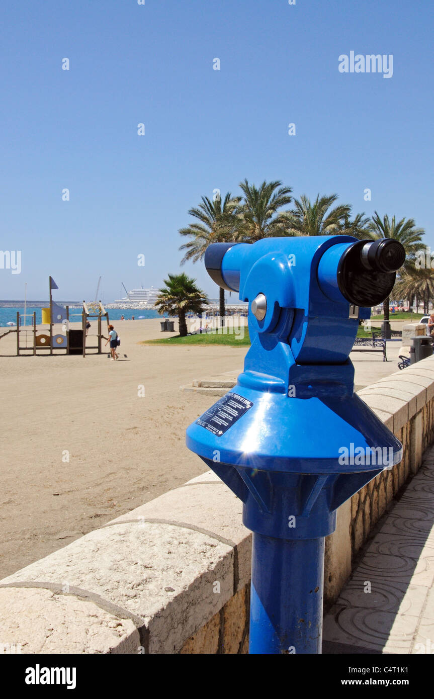 Telescope on the edge of Malagueta beach looking towards the port and Mediterranean sea, Malaga, Costa del Sol, Spain. Stock Photo