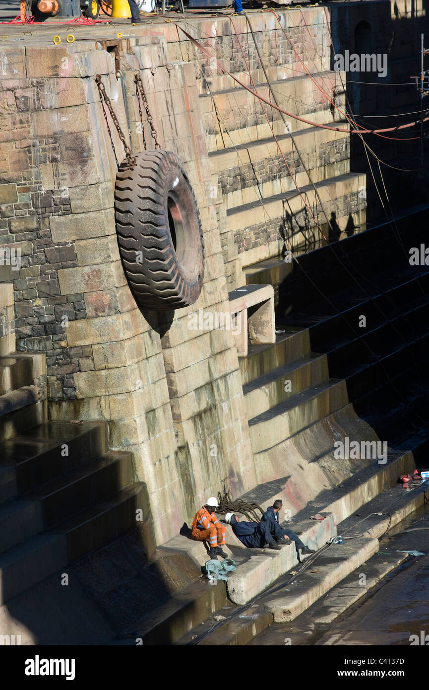Workers in a dry dock having a break Cape Town South Africa Stock Photo