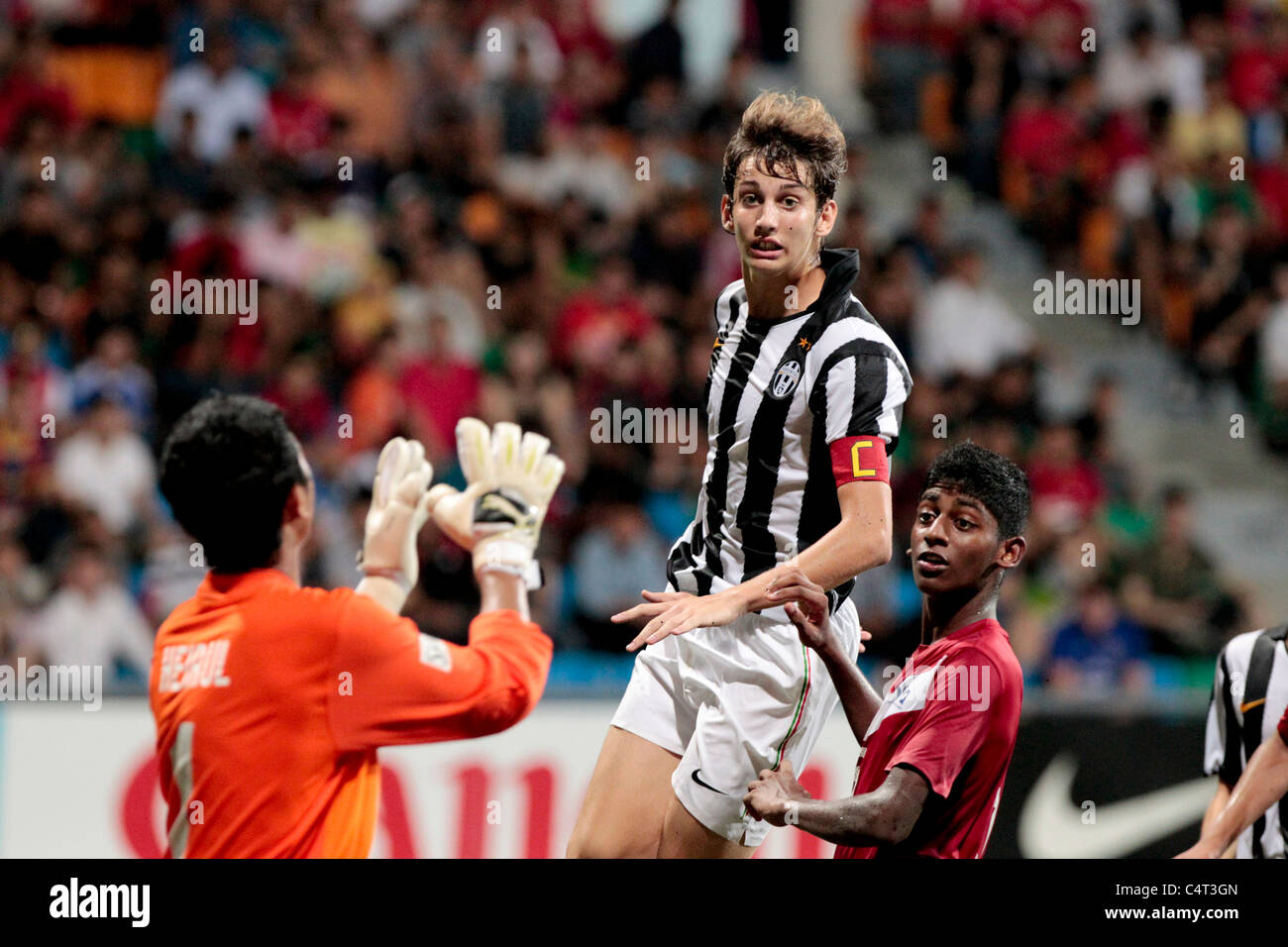 Guiducci Niccolo of Juventus FC U15(center) goes up for the aerial ball during the 23rd Canon Lion City Cup. Stock Photo