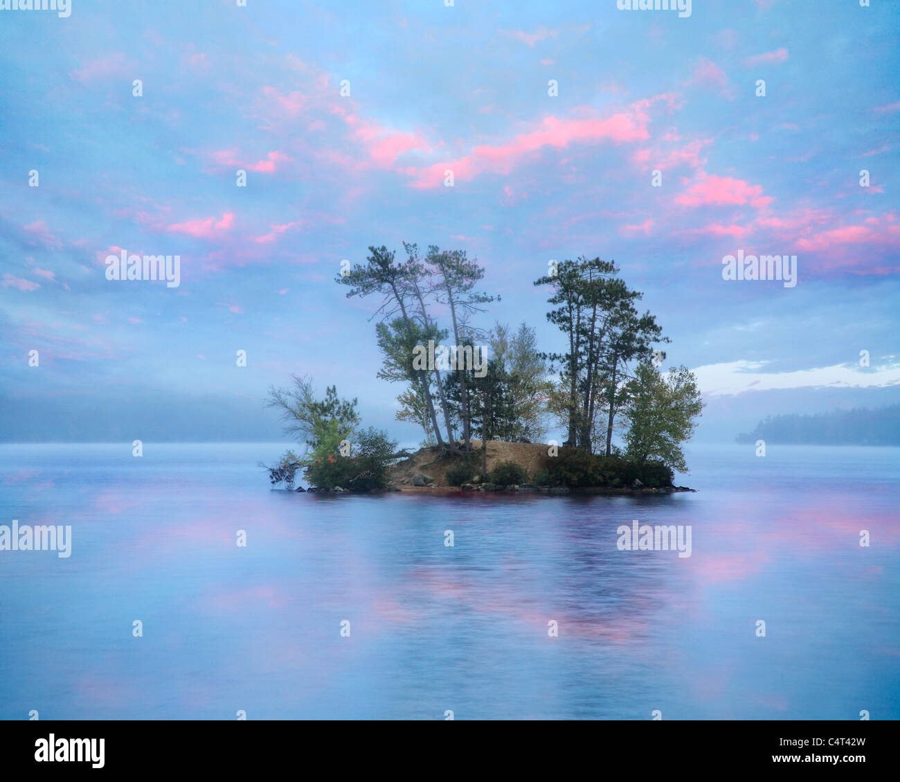 A Small Island On A Slightly Foggy Evening At Moose Pond, Maine, USA Stock Photo