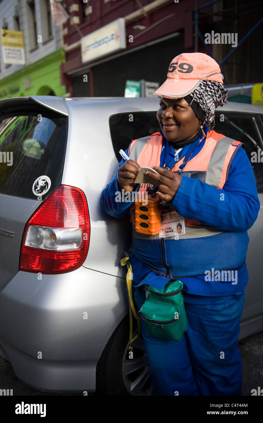 Marshal collecting parking fee in Cape Town South Africa Stock Photo