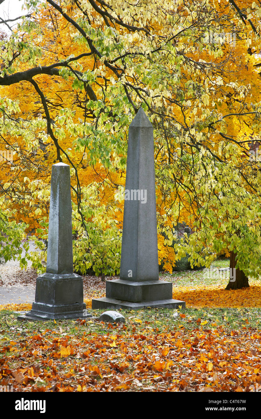 Obelisk Shaped Grave Stones Surrounded By The Beautiful Colors Of Autumn, Southwestern Ohio, USA Stock Photo