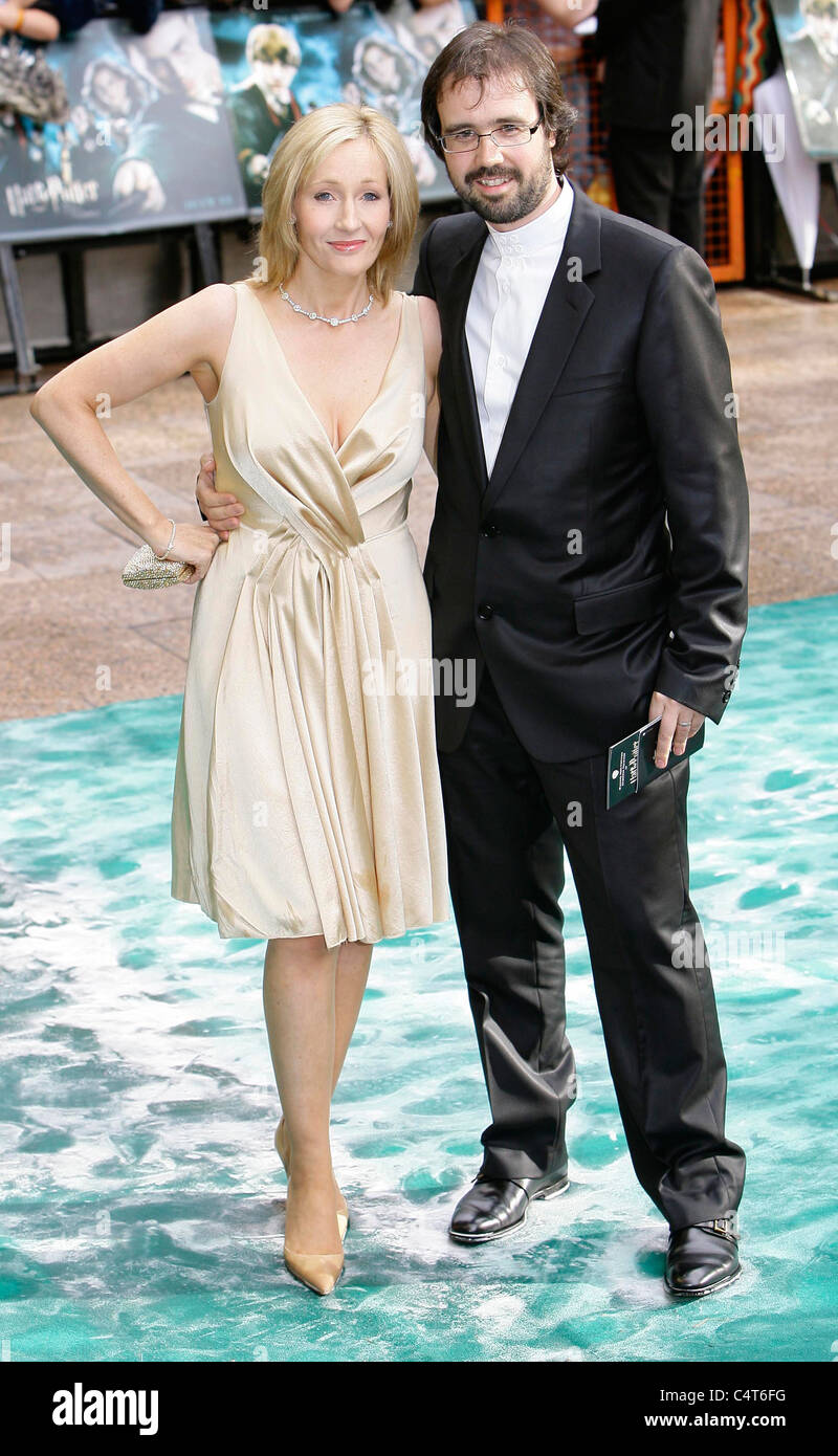 English author JK Rowling and her husband Dr Neil Murray arrive at the premier of 'Harry Potter and the Order of the Phoenix' Stock Photo