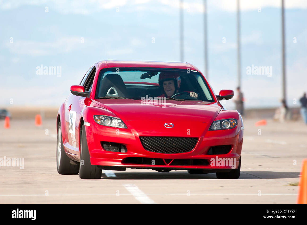 Denver, CO - A 2004 Red Mazda RX-8 in an autocross race at a regional Sports Car Club of America (SCCA) event. Stock Photo