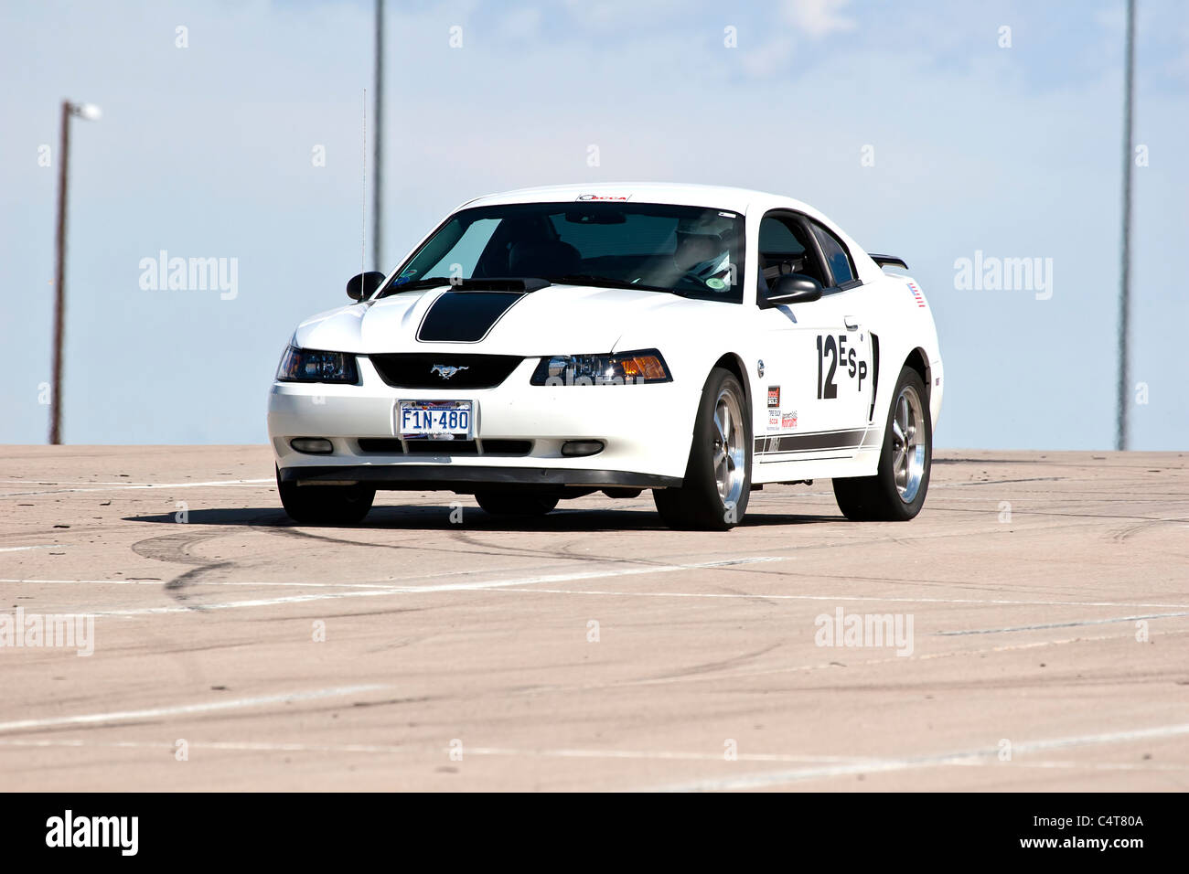 Denver, Colorado - 2004 White Ford Mach 1 Mustang in an autocross race at a regional Sports Car Club of America (SCCA) event. Stock Photo