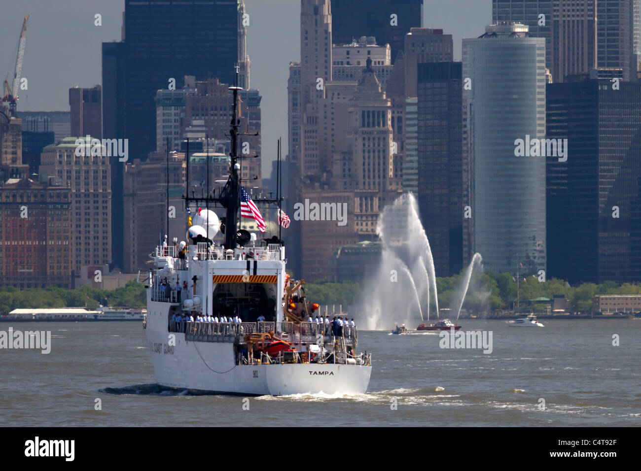 USCG cutter Tampa being saluted by NYFD fire boats as she heads up the Hudson River at the beginning of Fleet Week 2011 Stock Photo