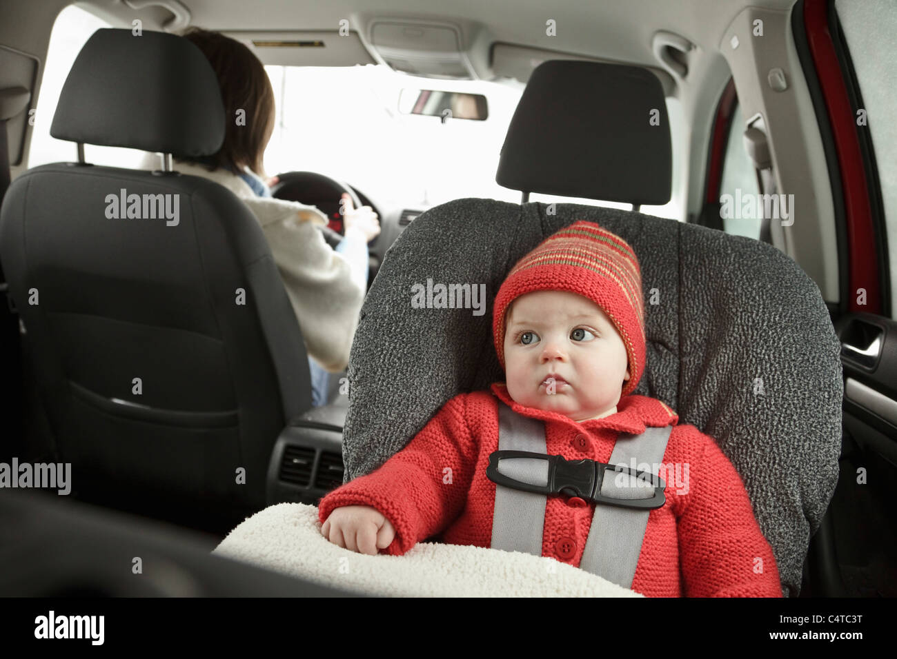 Baby in Car Seat with Mother Driving Stock Photo Alamy