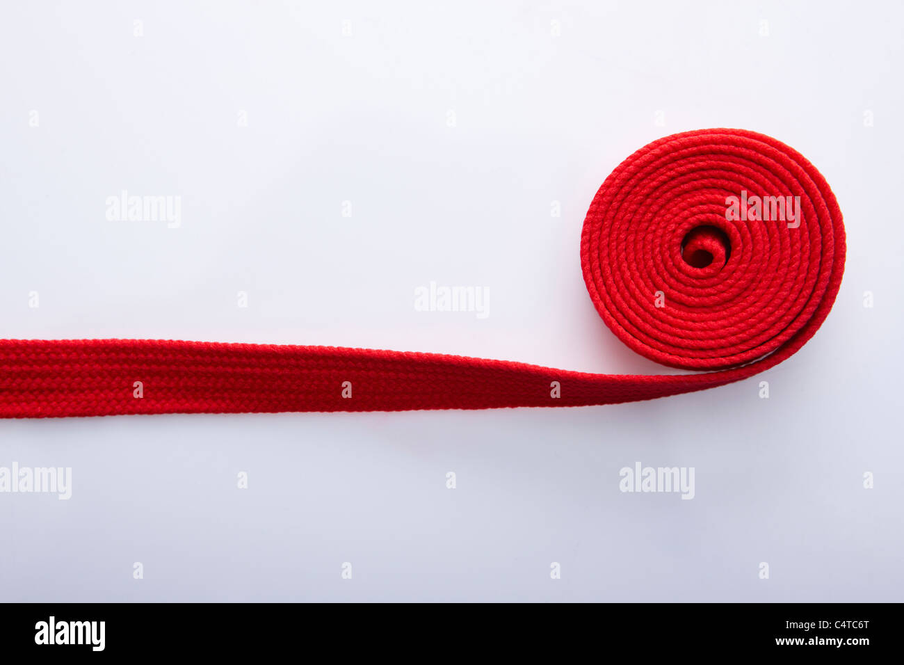 red color string rolled Stock Photo - Alamy