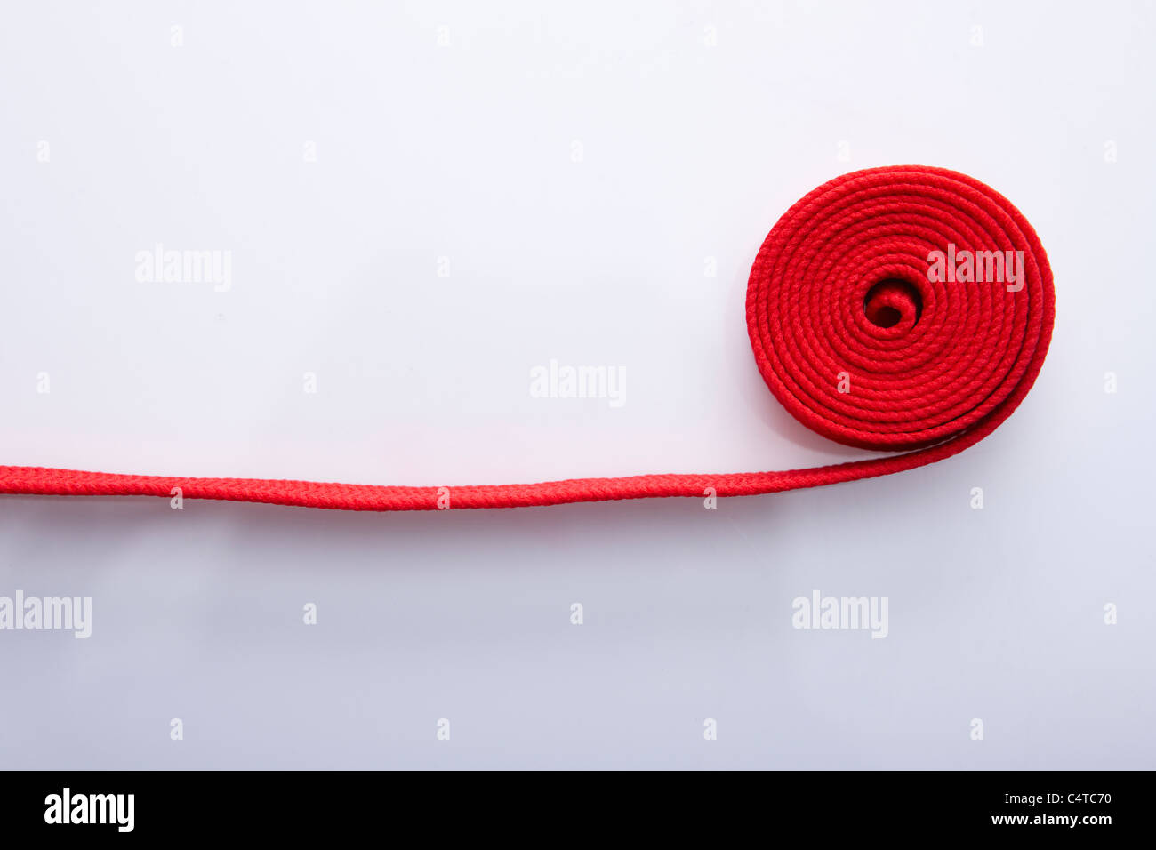 red color string rolled Stock Photo - Alamy
