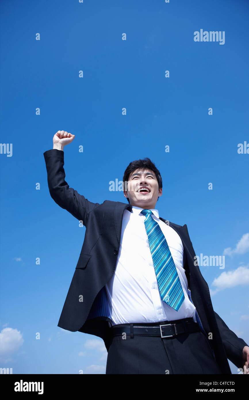 businessman raising his arms Stock Photo - Alamy