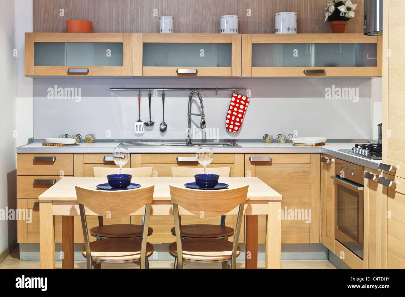 image of modern wood kitchen with table and chair Stock Photo - Alamy