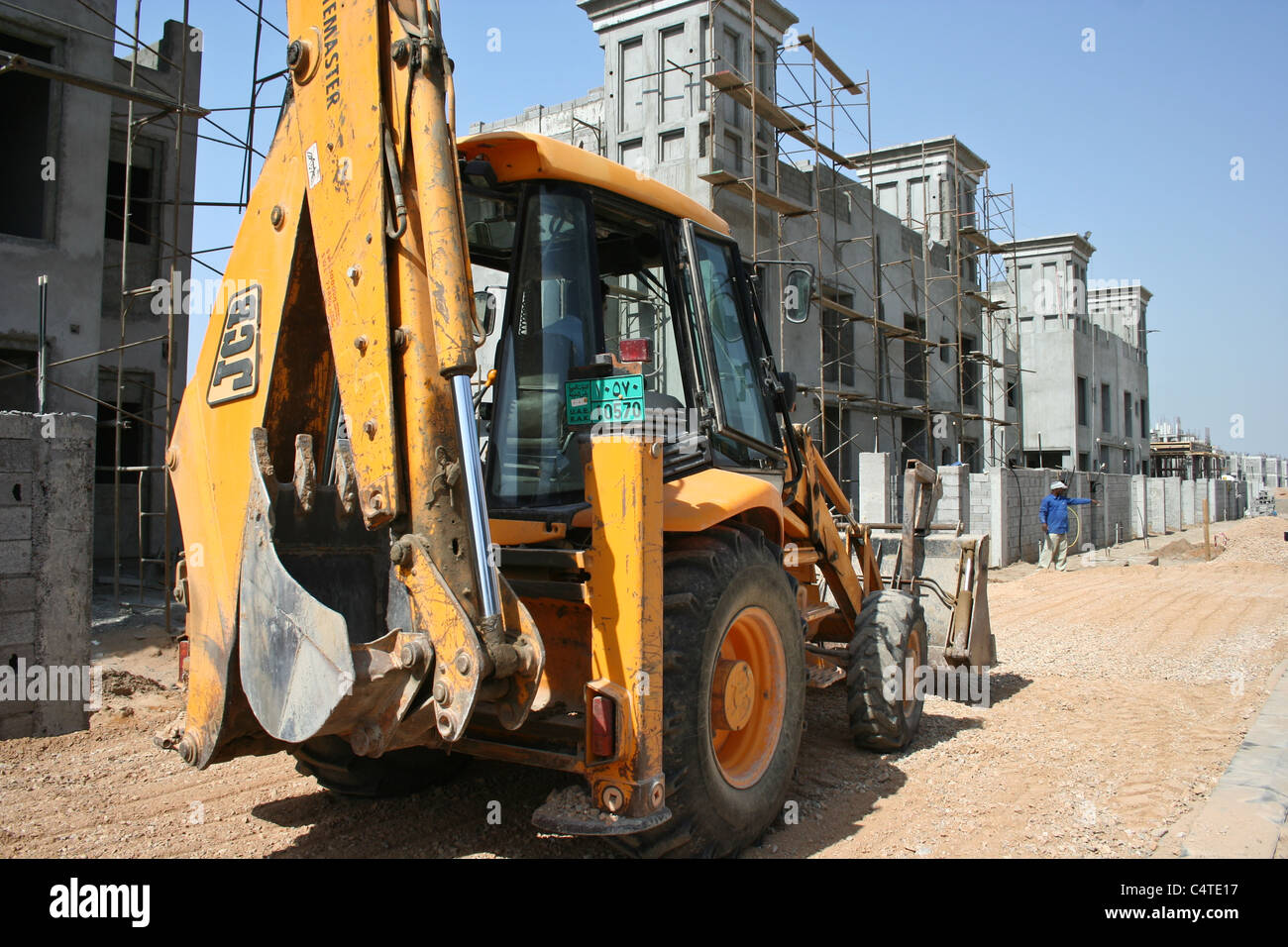 RAK Properties construction Industry housing UAE workers bulldozer Stock Photo