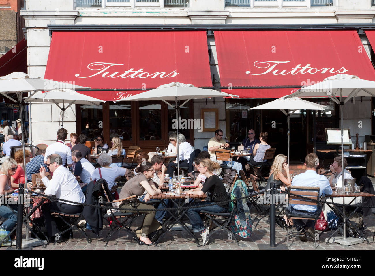 People enjoying al fresco dining at Tuttons restaurant, Covent Garden