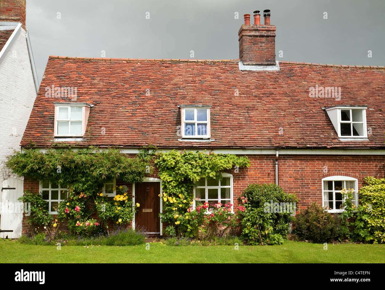Terraced English country cottages on the village green, Orford Village Suffolk UK Stock Photo