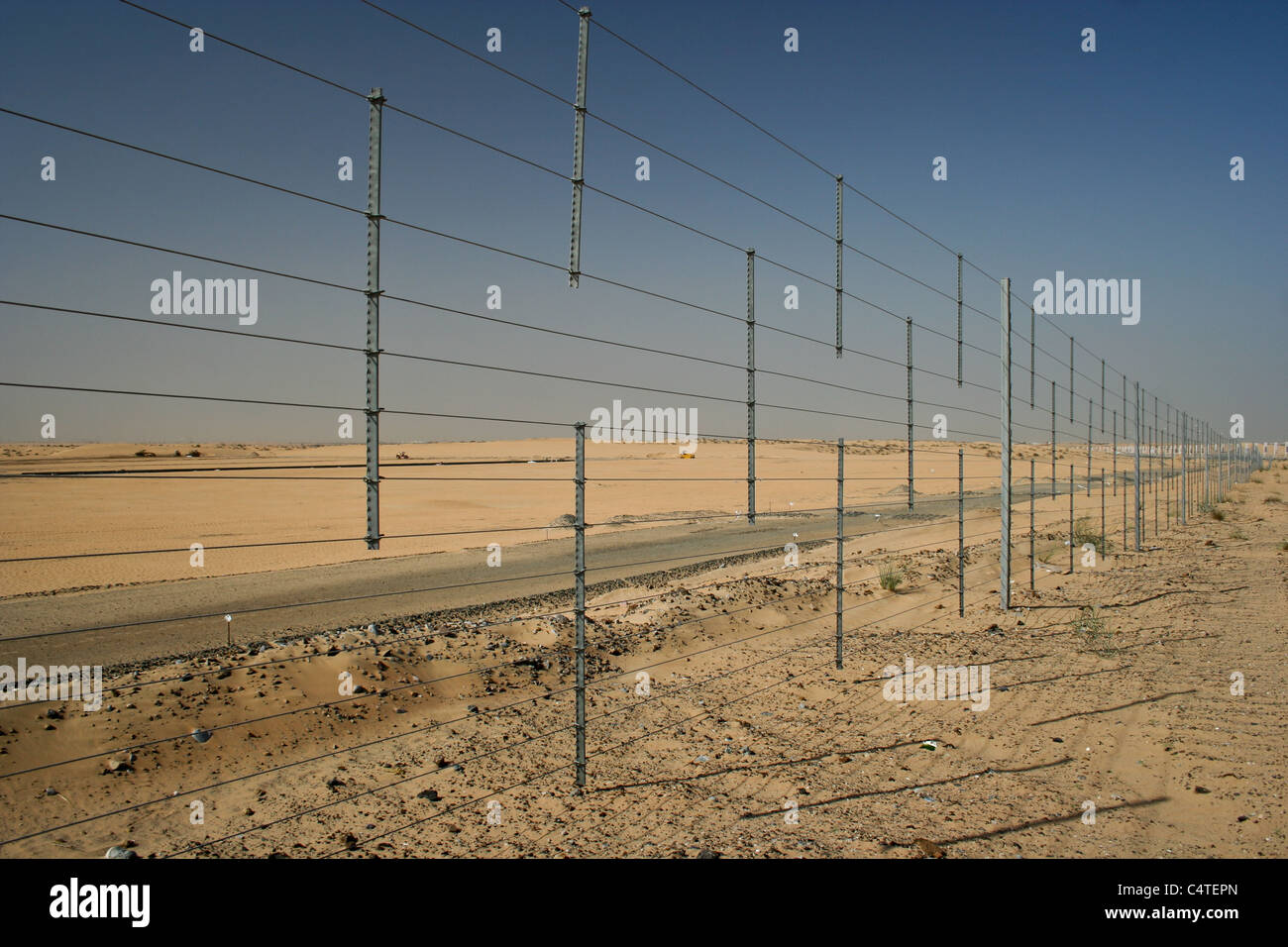 Barbed wire security fence fencing uae desert Stock Photo Alamy