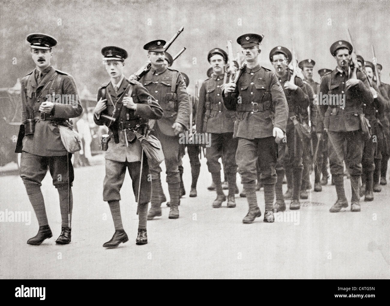 The Prince of Wales, later King Edward VIII, second from left, leading his company of Grenadier Guards in full service kit. Stock Photo