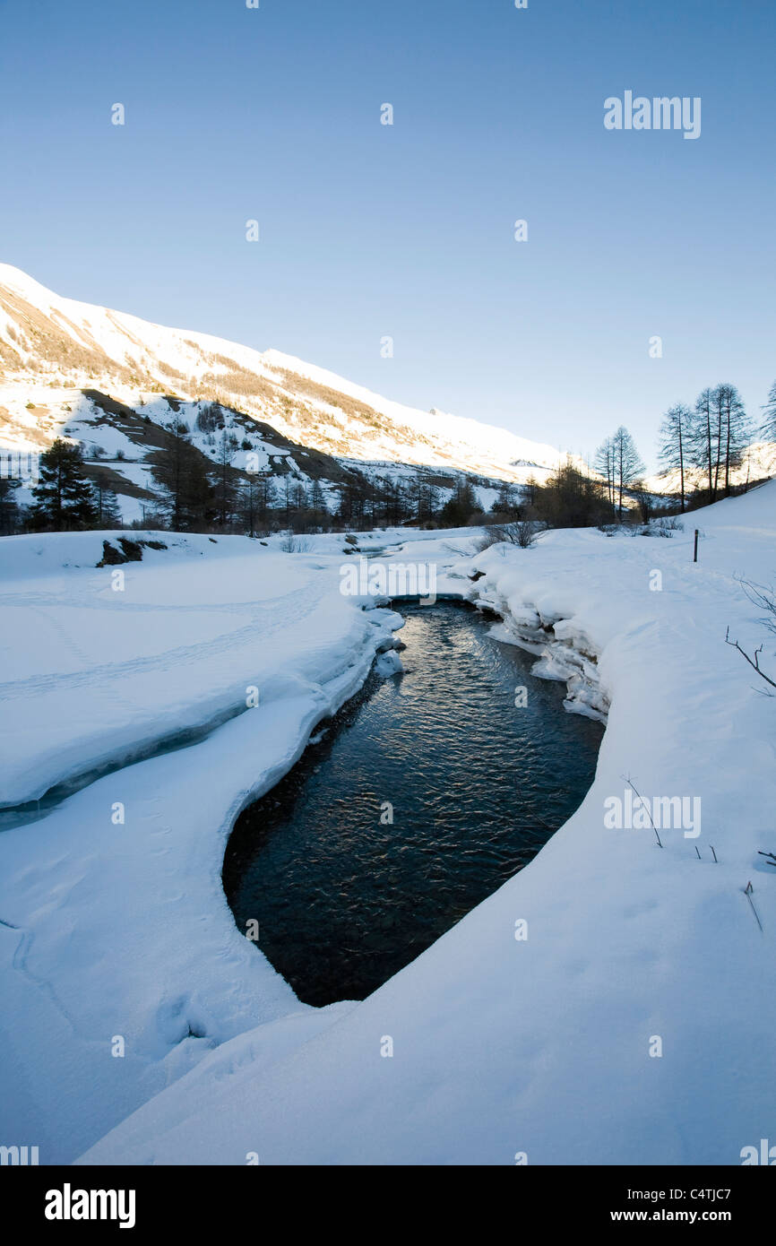 River in snowy landscape Stock Photo - Alamy