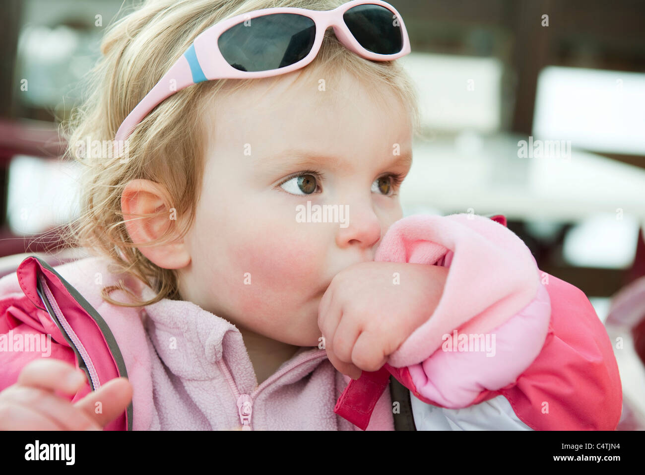 Toddler girl sucking her thumb Stock Photo